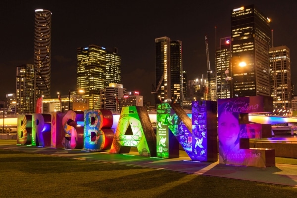 The Brisbane Sign illuminated against the night sky, showcasing the city's vibrant spirit and skyline, Brisbane, Australia