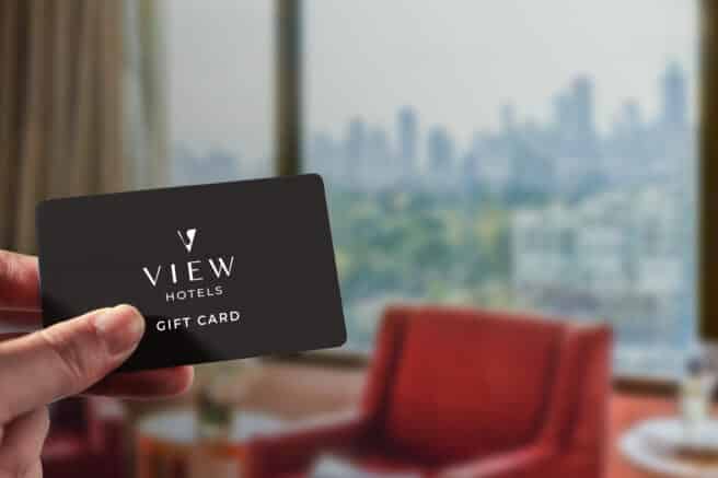 A gift card showcasing a scenic view of Melbourne, with the city skyline, Yarra River, and a partly cloudy sky in the background. Text reads “Gift Card”.