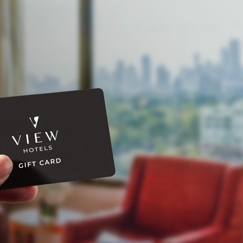 A gift card showcasing a scenic view of Melbourne, with the city skyline, Yarra River, and a partly cloudy sky in the background. Text reads “Gift Card”.