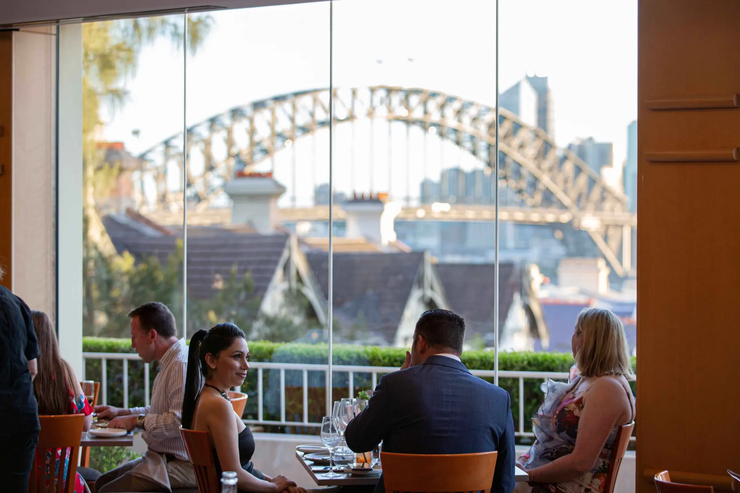A table set for dinner in LB's Restaurant with the harbour beyond