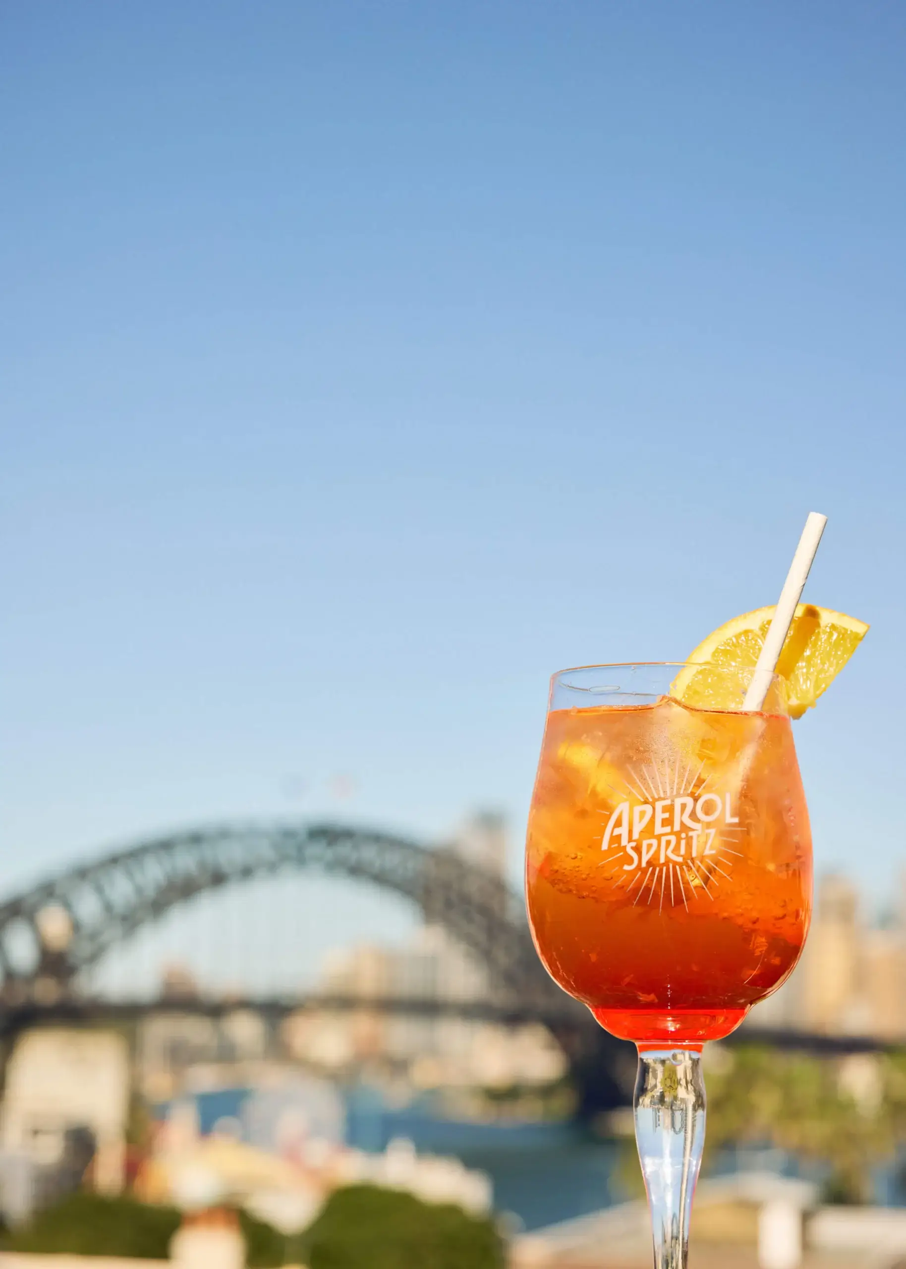 An Aperol Spritz on the terrace with the Harbour Bridge behind